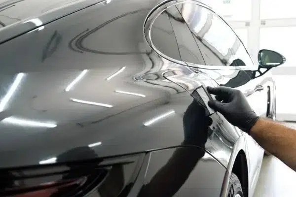 Ceramic coating being applied to vehicle paint