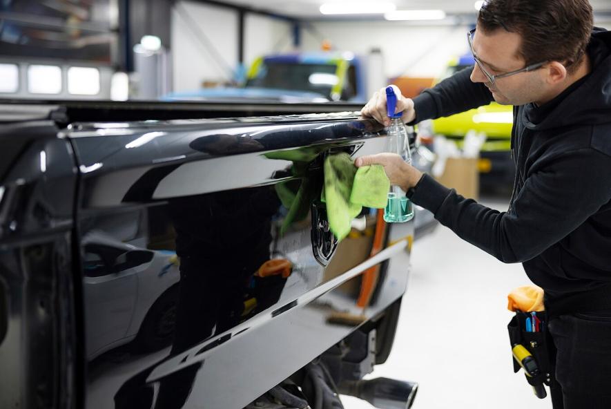 a man cleaning a car