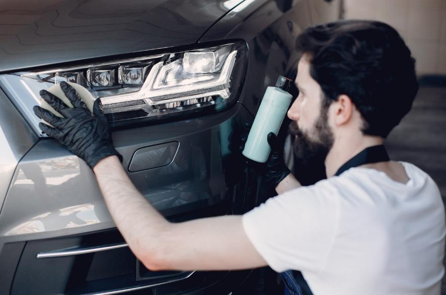a man polishing a car
