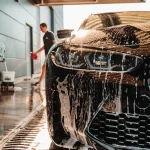 Vehicle receiving an exterior detailing hand wash